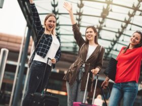 girls are smiling happily raising their hands